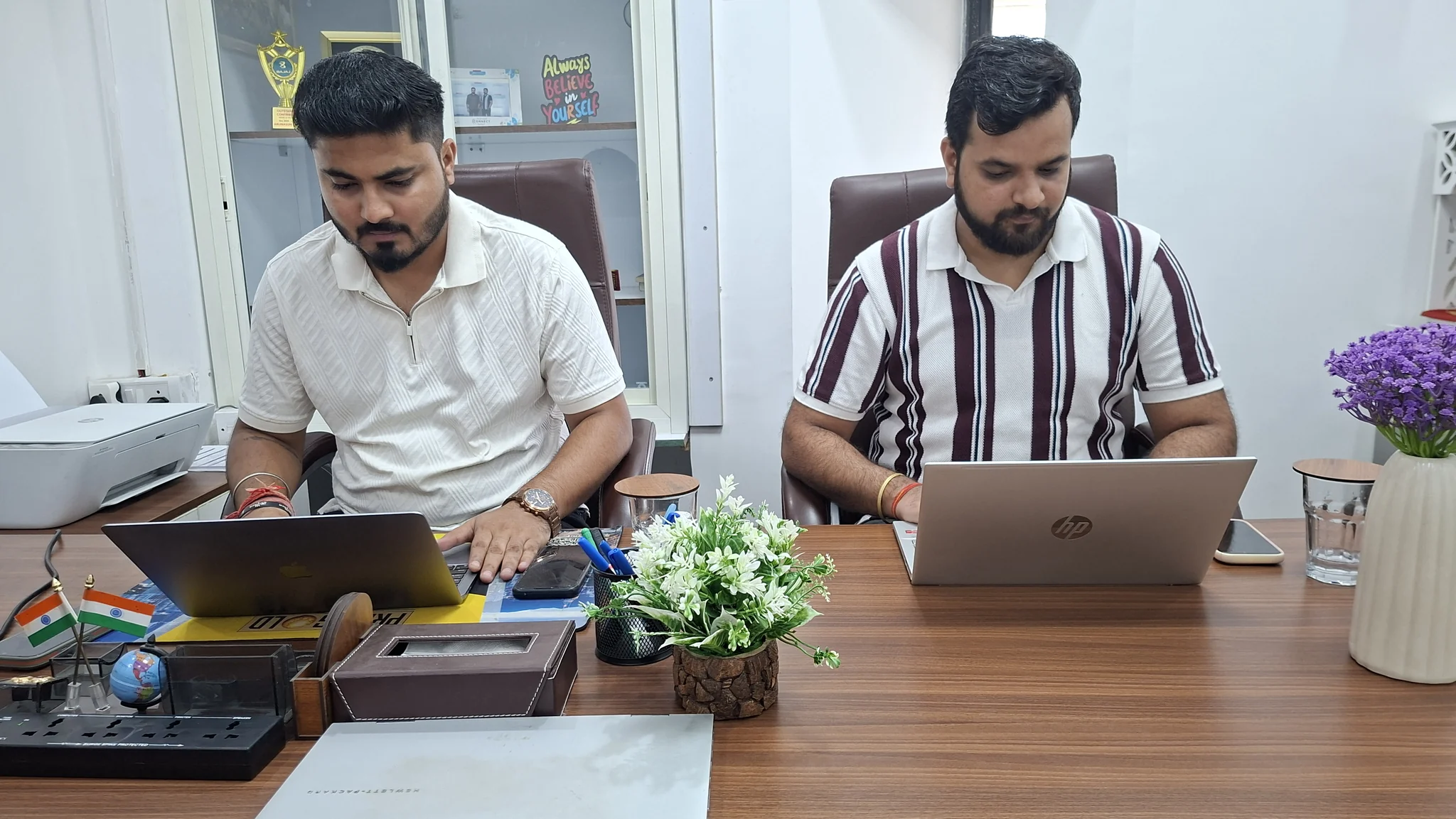 Team members working at office desks